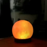 Illuminated moon lamp emitting a warm glow, perfect for science-themed decor and educational purposes.