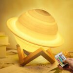 Realistic Saturn planet lamp made of wood with detailed rings, perfect for educational decor and space enthusiasts. Includes remote control for adjustable lighting.