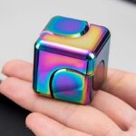 Iridescent magnetic cube toy with colorful, reflective surface, perfect for science experiments, educational activities, and decorative purposes.