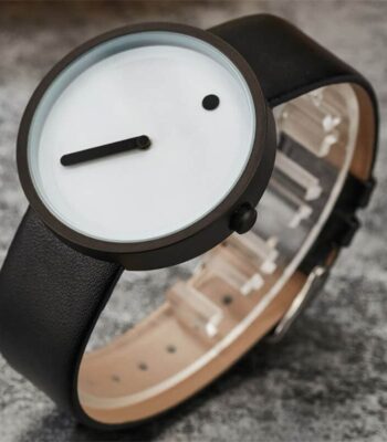 Modern minimalist wristwatch with a black leather strap, white dial, and simple design, perfect for science-inspired decor and educational gadgets.