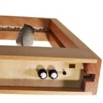 Small wooden weather station with LED indicators and sensors for educational science experiments.
