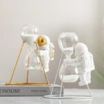 Astronaut and Hourglass Decor with Miniature Astronaut Figures.