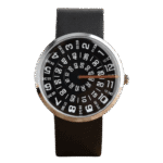 Analog wristwatch featuring a distinctive black dial with bold white numerals and a rotating orange hand, mounted on a black strap.