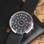 Modern wristwatch featuring a distinctive spiral dial with bold numerals and a sleek black strap, perfect for tech enthusiasts and fashion-forward individuals.