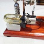 High-quality scientific apparatus with glass components and metal fittings, mounted on a wooden base, ideal for educational demonstrations and science projects.