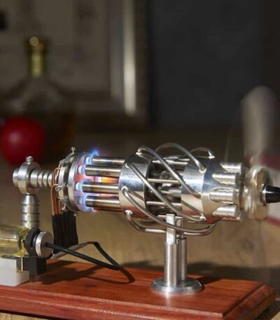 Demonstration of a thermoelectric generator with metal components and wiring on a wooden base, showcasing scientific principles of heat-to-electricity conversion.