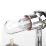 Laboratory glass syringe with metal and plastic components, used for scientific experiments and educational demonstrations.