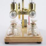 High-quality science experiment apparatus with glass jars and metal components, ideal for educational demonstrations and science decor.