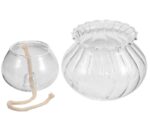 Oil lamp with a wick inside a round glass container and a matching decorative glass bowl.