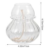 Clear glass fish bowl with a small skeleton inside, perfect for science decor or educational displays.