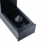 Black magnetic levitation device with conical magnet inside a sleek box, demonstrating magnetic field suspension for educational purposes.