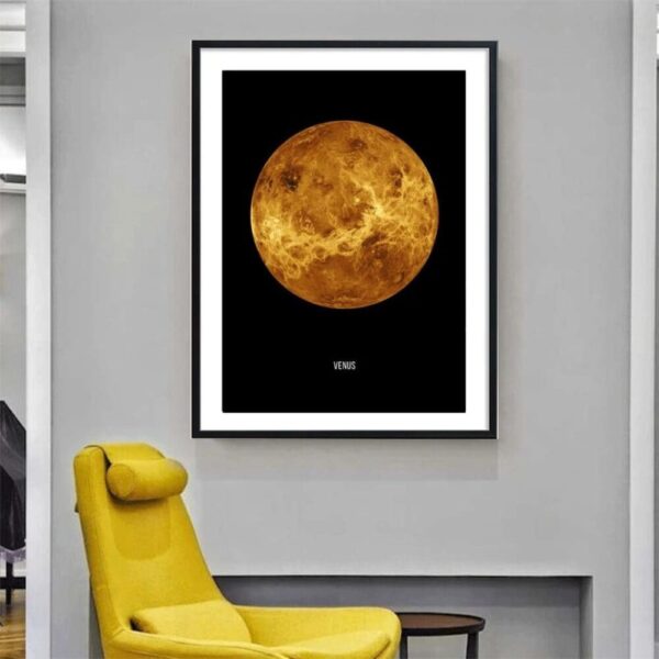 Artistic poster of the moon's surface displayed in a contemporary living room with a yellow armchair and minimalist decor.