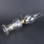 Vintage glass light bulb vacuum pump used for scientific experiments and demonstrations, showcasing historical scientific equipment.