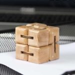 Wooden puzzle brain teaser for cognitive development and problem-solving skills. Made of natural wood, this educational toy is perfect for children and adults to challenge their minds.
