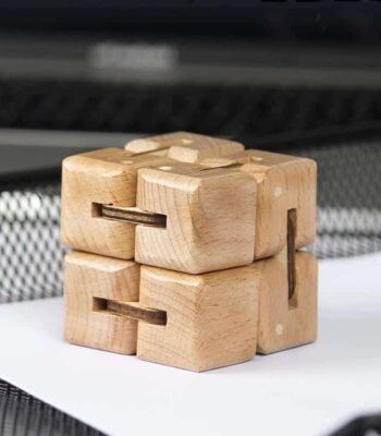 Wooden puzzle brain teaser for cognitive development and problem-solving skills. Made of natural wood, this educational toy is perfect for children and adults to challenge their minds.