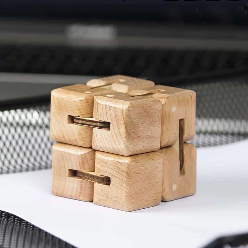 Wooden puzzle brain teaser for cognitive development and problem-solving skills. Made of natural wood, this educational toy is perfect for children and adults to challenge their minds.