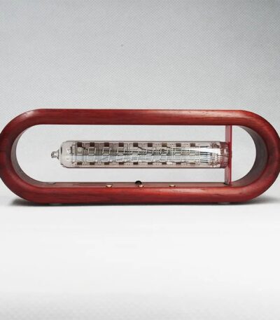 Vintage glass thermometer encased in a red wooden frame, showcasing a classic scientific instrument for temperature measurement.