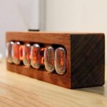 Vintage Nixie Tube Clock in Wooden Frame, Retro Electronic Display.
