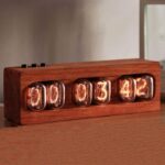 Wooden vintage nixie tube clock with glowing orange numerals on a wooden base, showcasing a retro style digital time display.