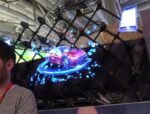 Futuristic holographic car display with digital effects.