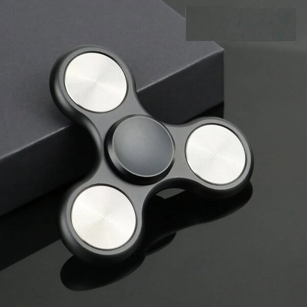 Modern black fidget spinner with illuminated white LED circles, designed for stress relief and focus enhancement.