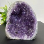 Beautiful purple amethyst geode with sparkling crystals, perfect for home decor and educational purposes.