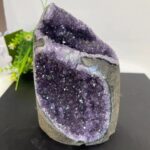 Beautiful purple amethyst geode with sparkling crystals, perfect for home decor or educational purposes.