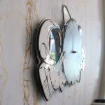 Alarm clock with a butterfly design, combining modern technology with decorative art.