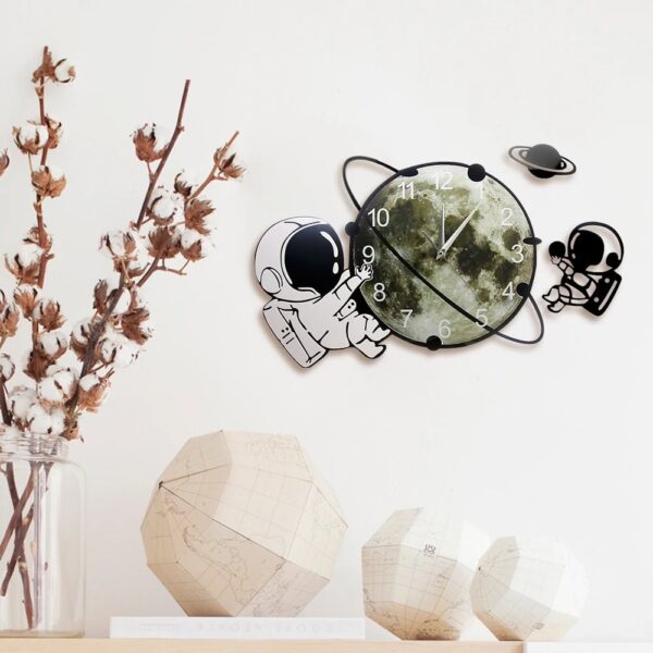 Space-themed wall clock with astronaut, planet, and moon illustrations, perfect for science and educational decor in kids' rooms or classrooms.