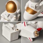 An astronaut figurine with a white suit and gold accents, designed for science-themed decor and educational purposes. Perfect for science enthusiasts and space lovers.