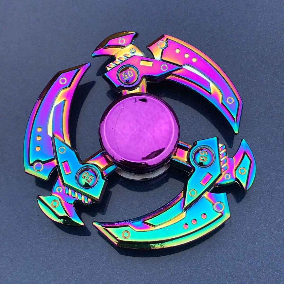 Fidget Spinner with Neon Colors and Circular Center Colorful neon-finished fidget spinner with a circular center and three curved blades, designed for stress relief and focus enhancement.