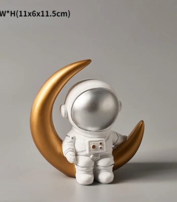 Adorable astronaut figurine sitting on a gold crescent moon, perfect for space-themed decor and educational displays.