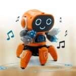 A cute orange and gray robot toy with a digital face displaying a happy expression, surrounded by musical notes, designed for educational and entertainment purposes.