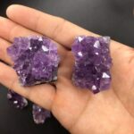 Amethyst crystal clusters with vibrant purple hues, perfect for educational displays or decorative purposes. These natural mineral specimens showcase the beauty of crystalline formations.