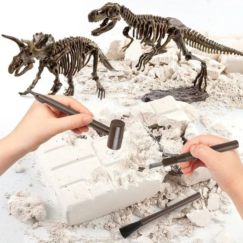 Dinosaur Skeleton Excavation Kit for Kids Hands using excavation tools to uncover dinosaur skeleton fossils in a white plaster block, educational toy for children to learn about paleontology and fossils.