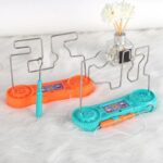 Interactive wire maze game for kids and adults, featuring colorful plastic bases and metal wires for educational fun.