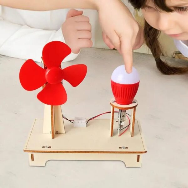 Child demonstrating a DIY wind turbine and light bulb experiment with a small red wind turbine and a light bulb on a wooden base, promoting renewable energy education.