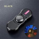 Fidget spinner featuring LED lights and a sleek black design, perfect for stress relief and focus enhancement. Compact and portable, ideal for kids and adults alike.