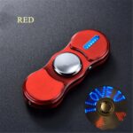 LED light-up fidget spinner in red with metallic center and blue illuminated "LOVE" text on the disc.
