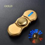 Fidget spinner featuring a sleek gold finish with LED lights that illuminate when spun, providing a mesmerizing visual effect and stress relief.