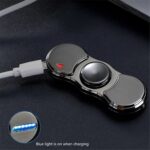 Portable wireless power bank with LED indicator and sleek metallic design, compatible with smartphones for convenient charging on the go.
