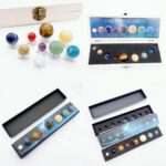 Collection of miniature solar system planets with display cases, ideal for educational purposes and home decor, featuring detailed planetary models in various sizes and colors.
