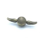 A steampunk-style globe keychain with metallic wings on each side, featuring intricate detailing and a vintage finish.
