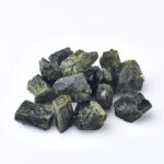 Group of green tourmaline mineral crystals on a white background, ideal for science decor and educational toys.