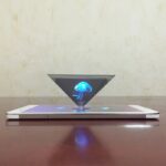 Interactive hologram of a jellyfish projected above a smartphone, demonstrating augmented reality technology for educational and science decor purposes.