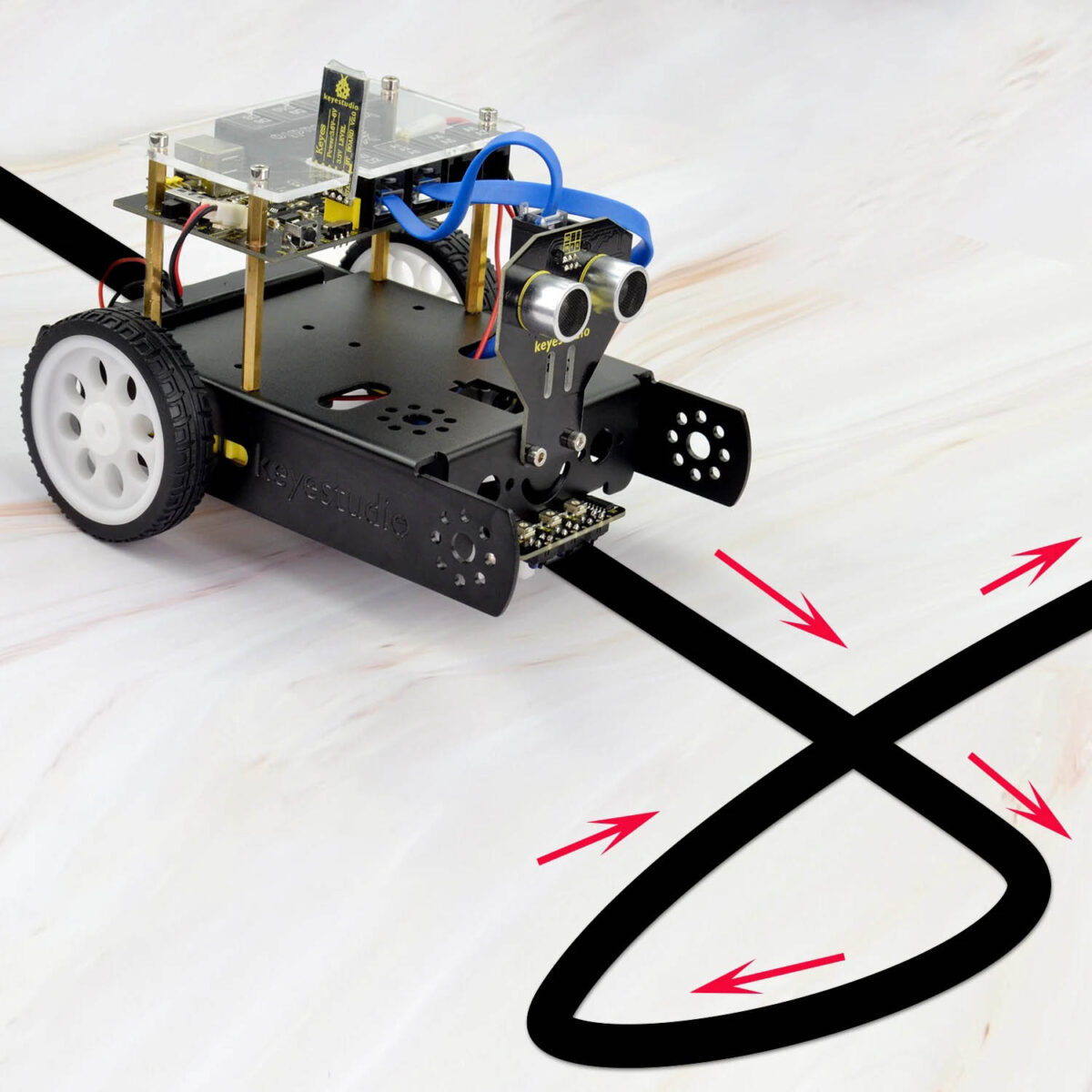 Small robotic car following a black line on a white surface, equipped with sensors and wheels, demonstrating line-following technology for educational purposes.