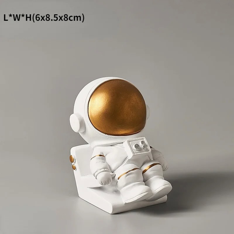 Science Astronaut Figurine | Space Decor & Educational Toy Astronaut figurine with a white suit and gold helmet, perfect for science-themed decor and educational purposes.