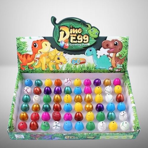 Colorful dinosaur-themed growing pet eggs in a display box, perfect for educational and fun science toys for children aged 3 and up.