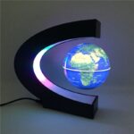 Illuminated globe lamp featuring a modern black frame and colorful LED lighting, perfect for educational decor and science enthusiasts.