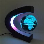 Illuminated globe with a modern, futuristic design featuring vibrant blue and purple lighting, perfect for science enthusiasts and educational settings.